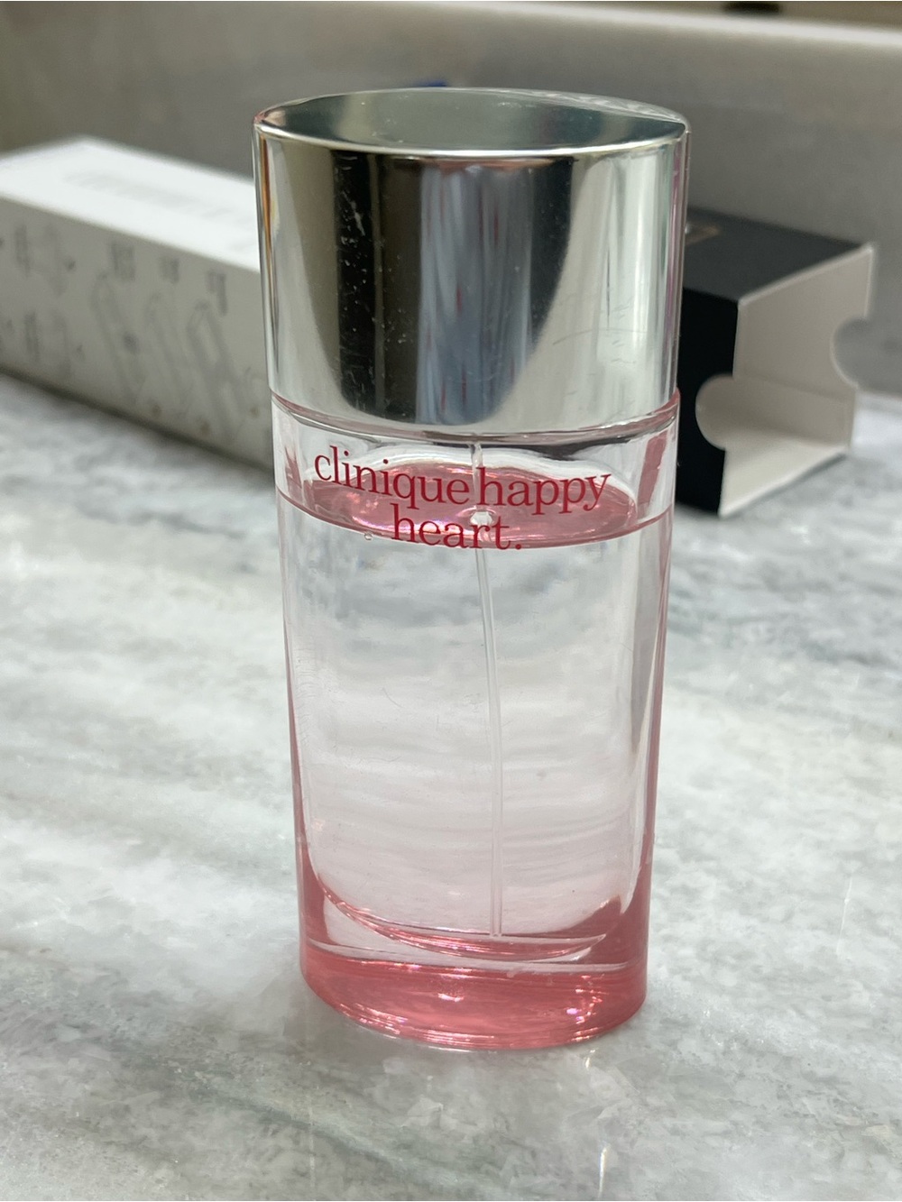 Clinique pink clear Happy Heart women's skincare bottle